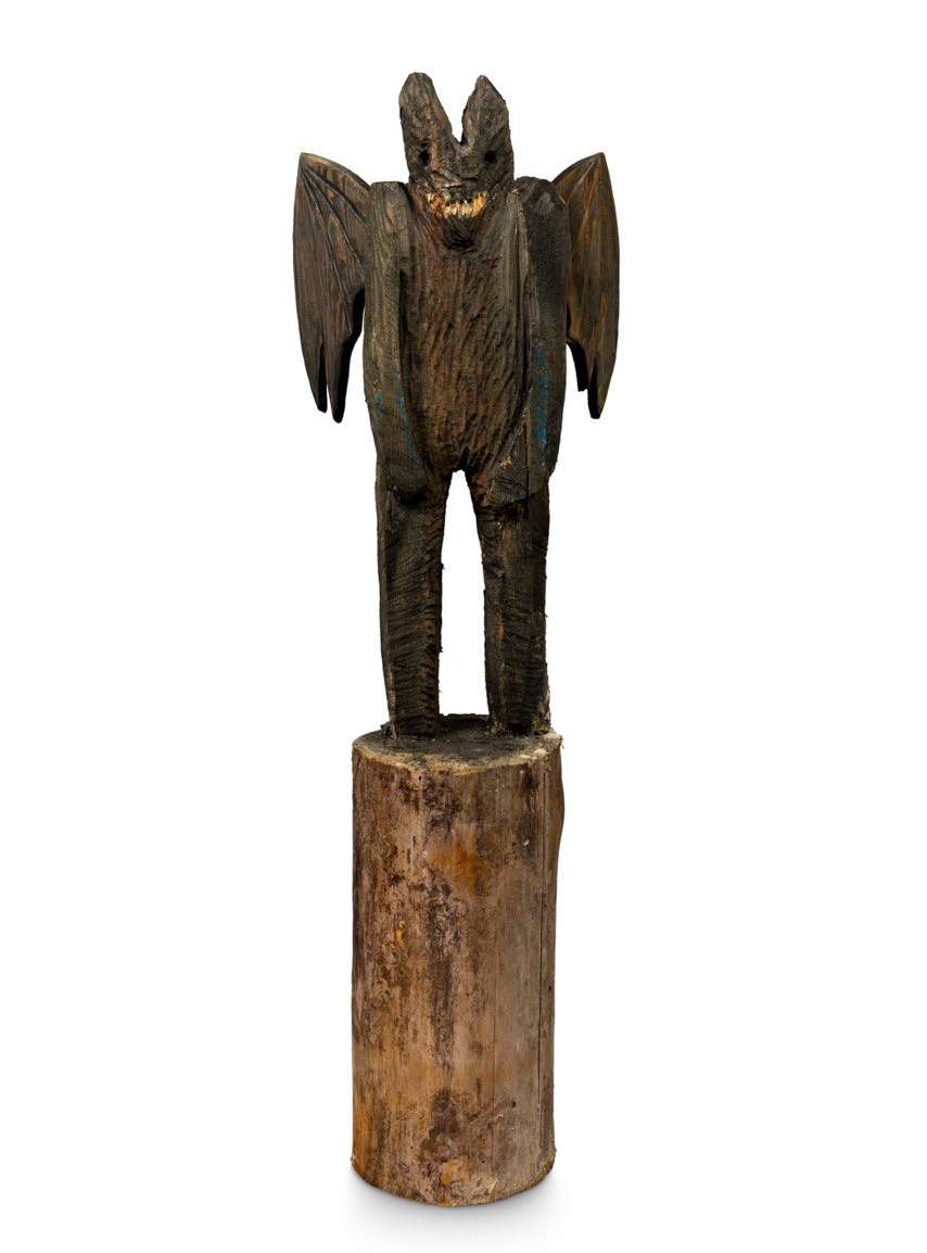 Wooden sculpture titled Demon