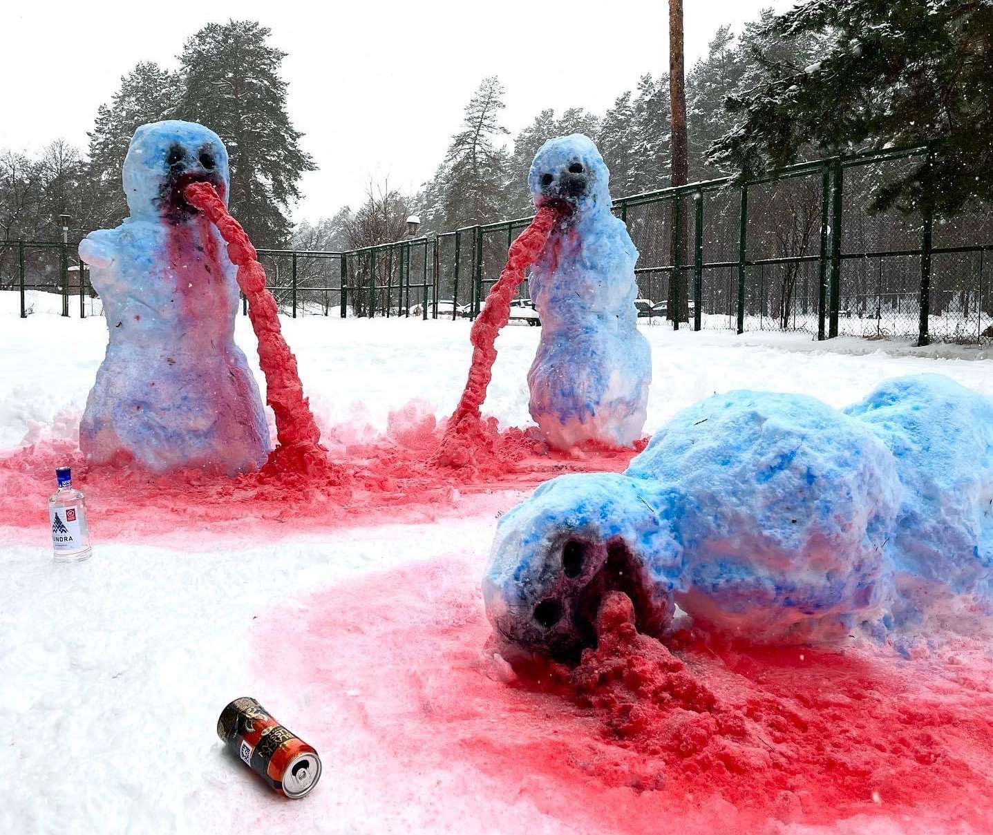 Colorful snow sculptures surrounded by red snow