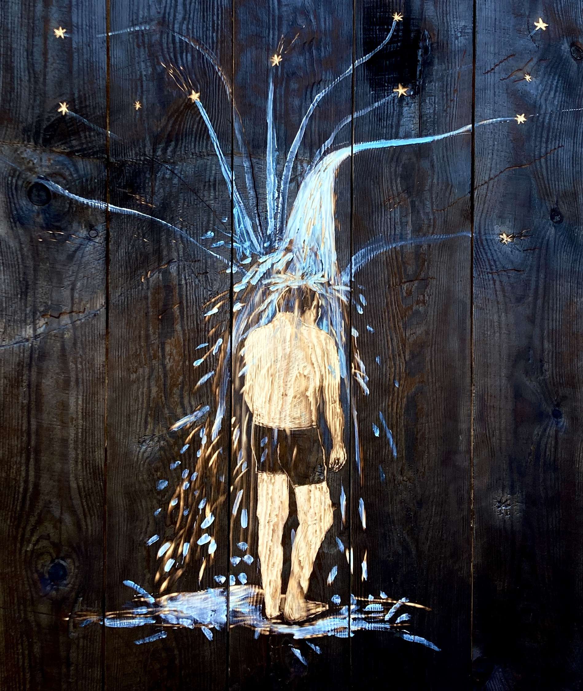 Star waterfall carved into a burnt wooden board